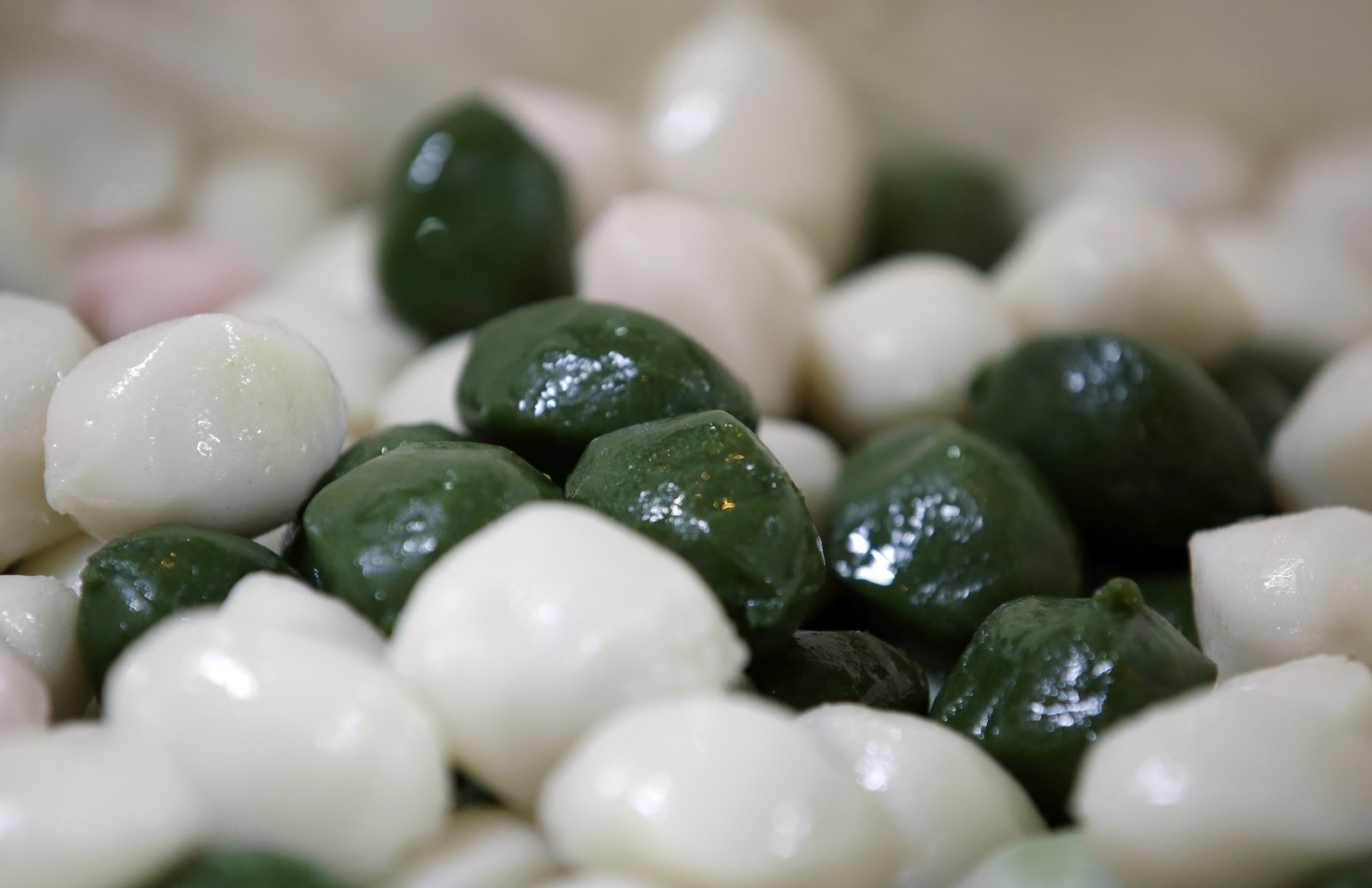 Songpyeon, the half-moon rice cakes eaten at Chuseok, arranged on a tray at a Seoul rice-cake shop