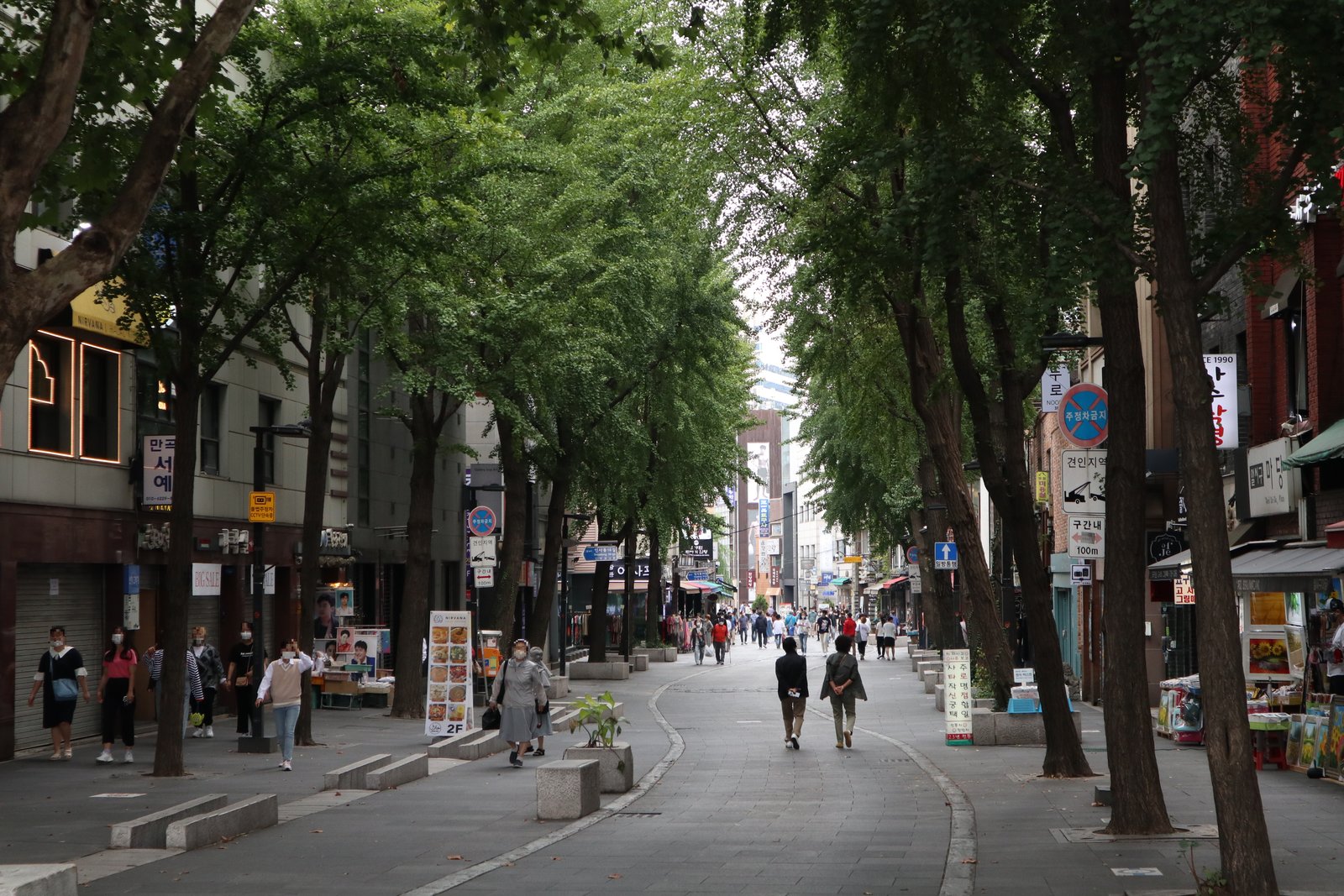 Tree-lined Insadong-gil pedestrian street with craft shops and galleries in Seoul