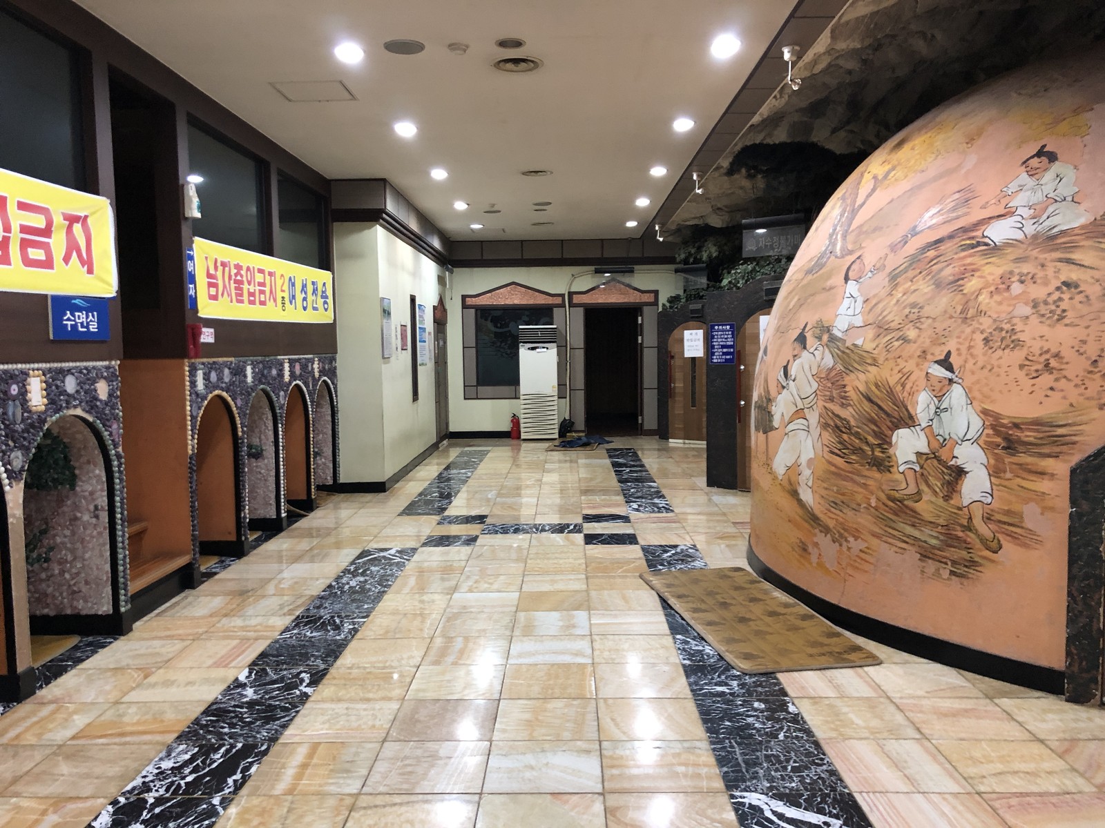 Archive photo of jjimjilbang heated rooms and resting areas, March 2020. It does not show either Seoul venue compared in this guide.