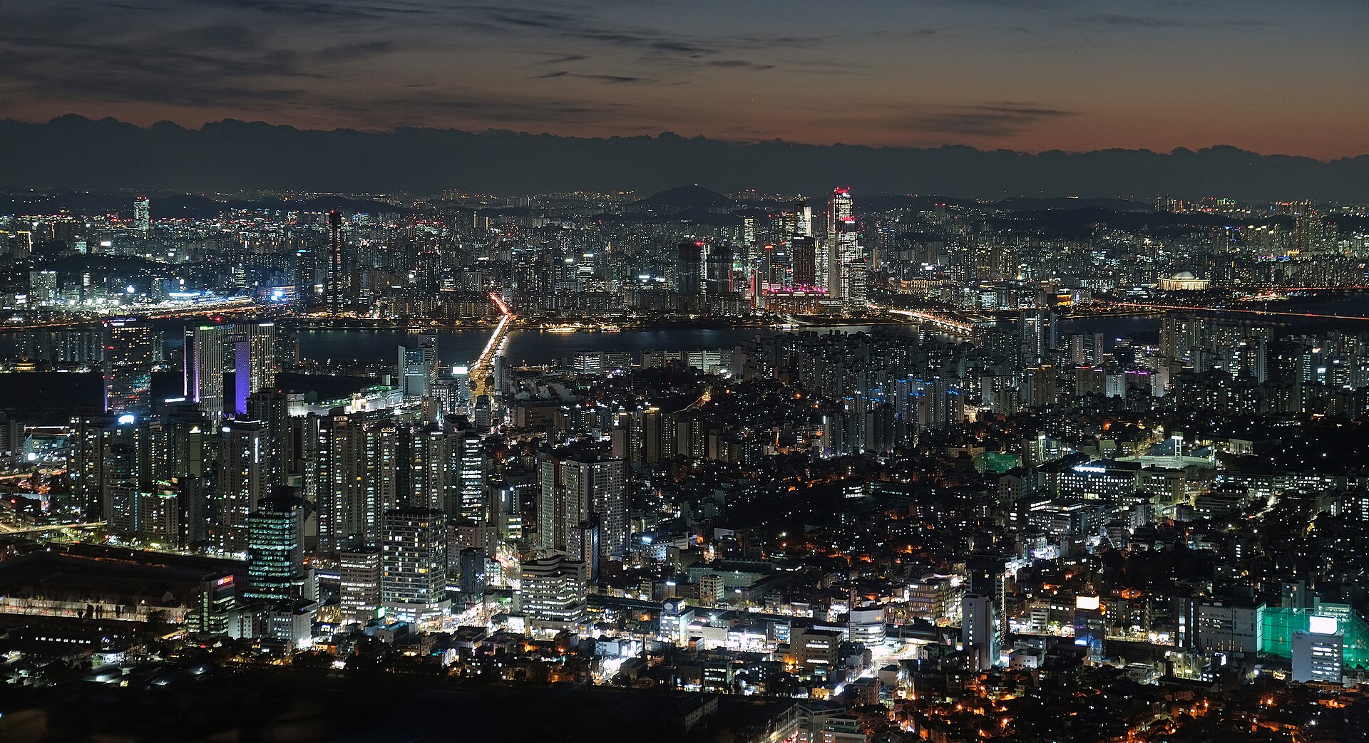 N Seoul Tower rising above the forest of Namsan mountain